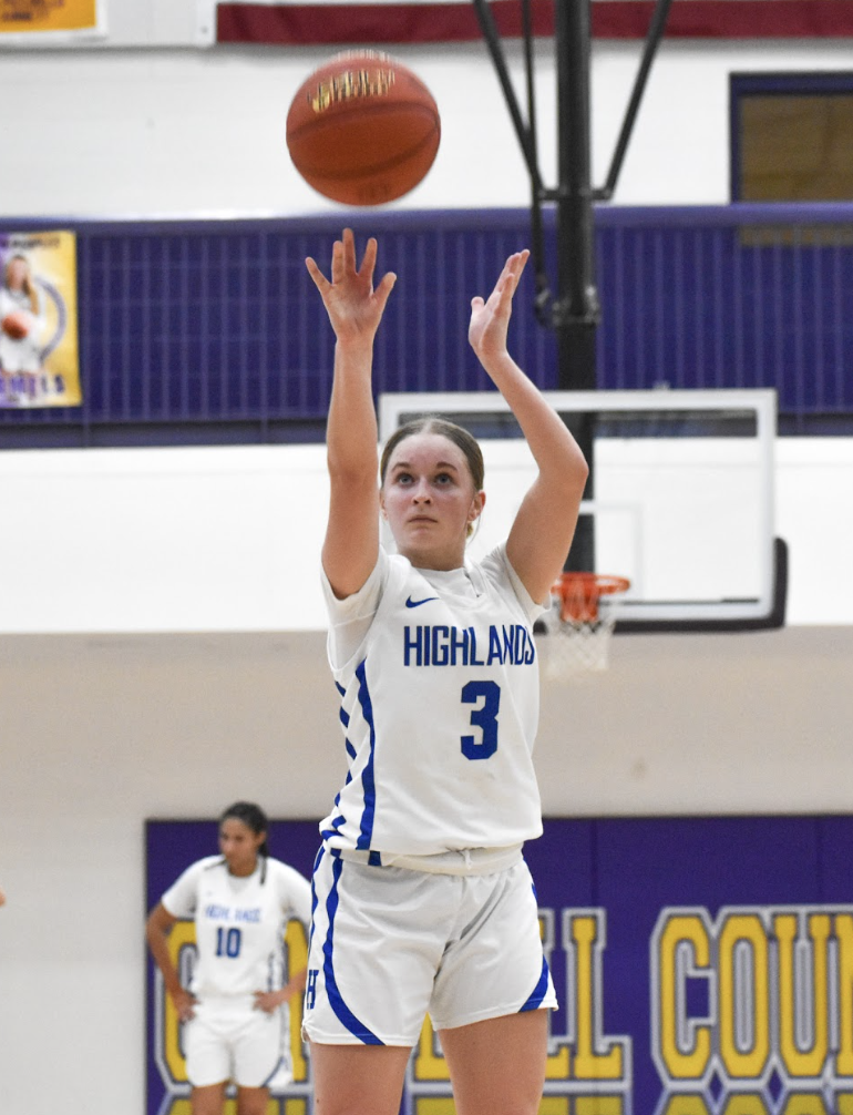 Maren Orme (9) follows through with her free throw shot. “I walk back a little bit and I take a deep breath before I shoot, just so I can stay focused for the free throw,” Orme said.